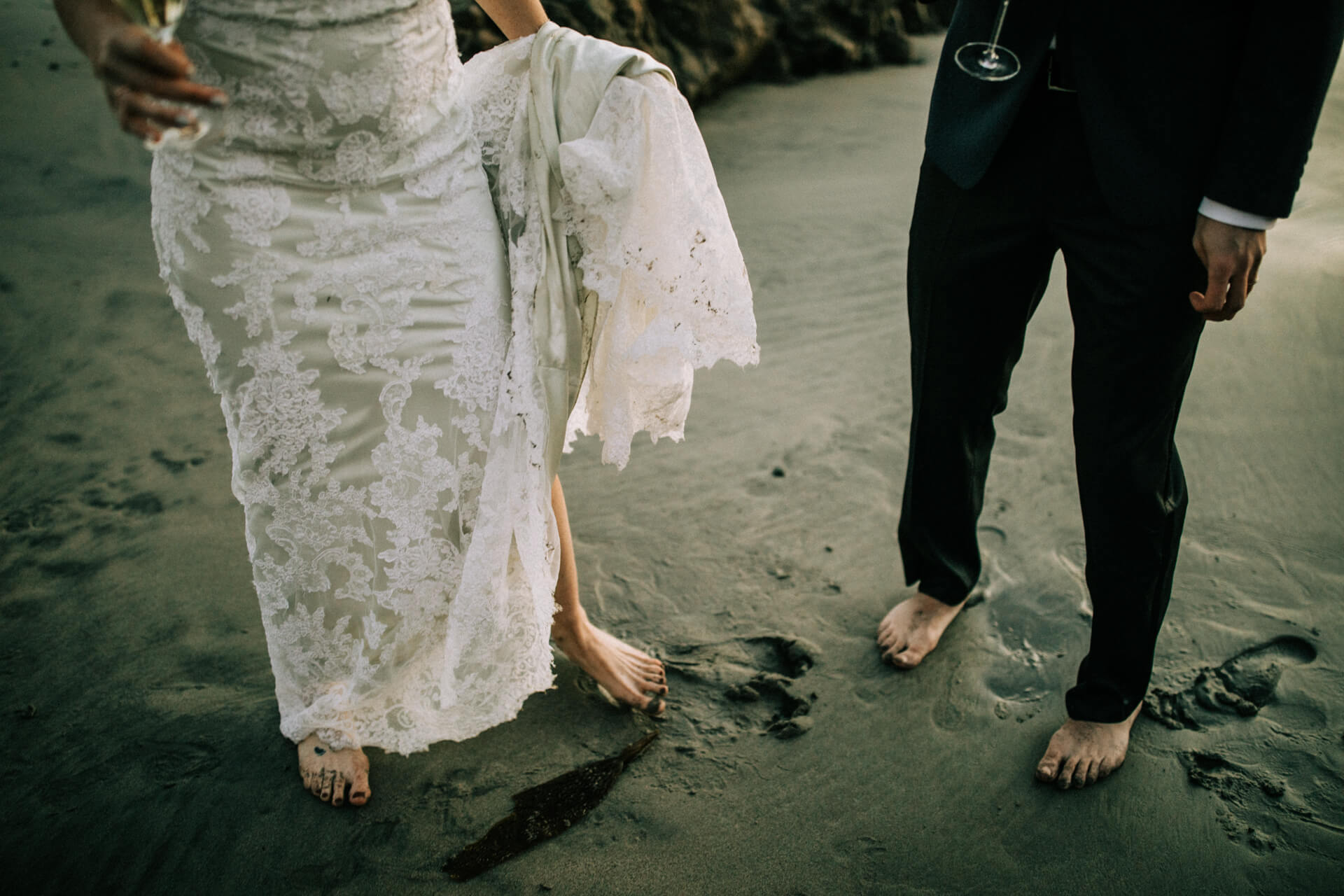 Des Moines Wedding Photographers The bride and groom's footprints in the sand