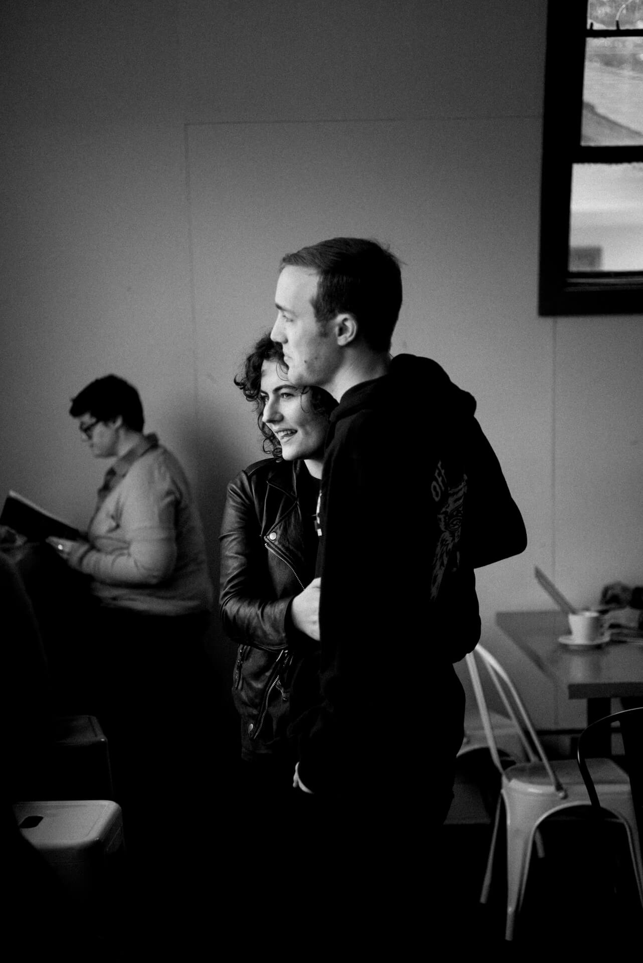 Des Moines Wedding Photographers A bride and groom see each other at a coffee shop before the wedding