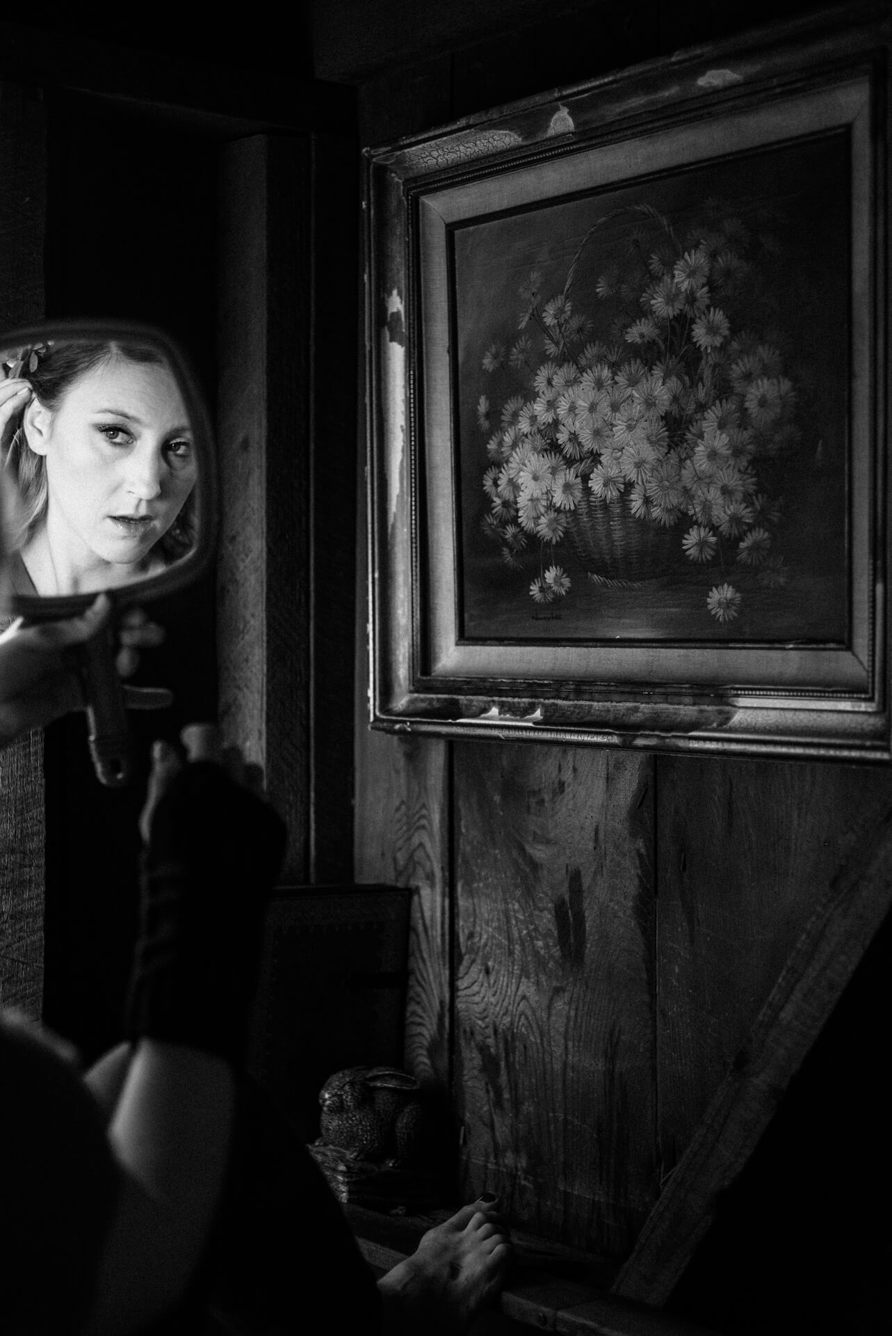 Des Moines Wedding Photographers Bride getting ready before her elopement at Deetjens Inn in Big Sur, California