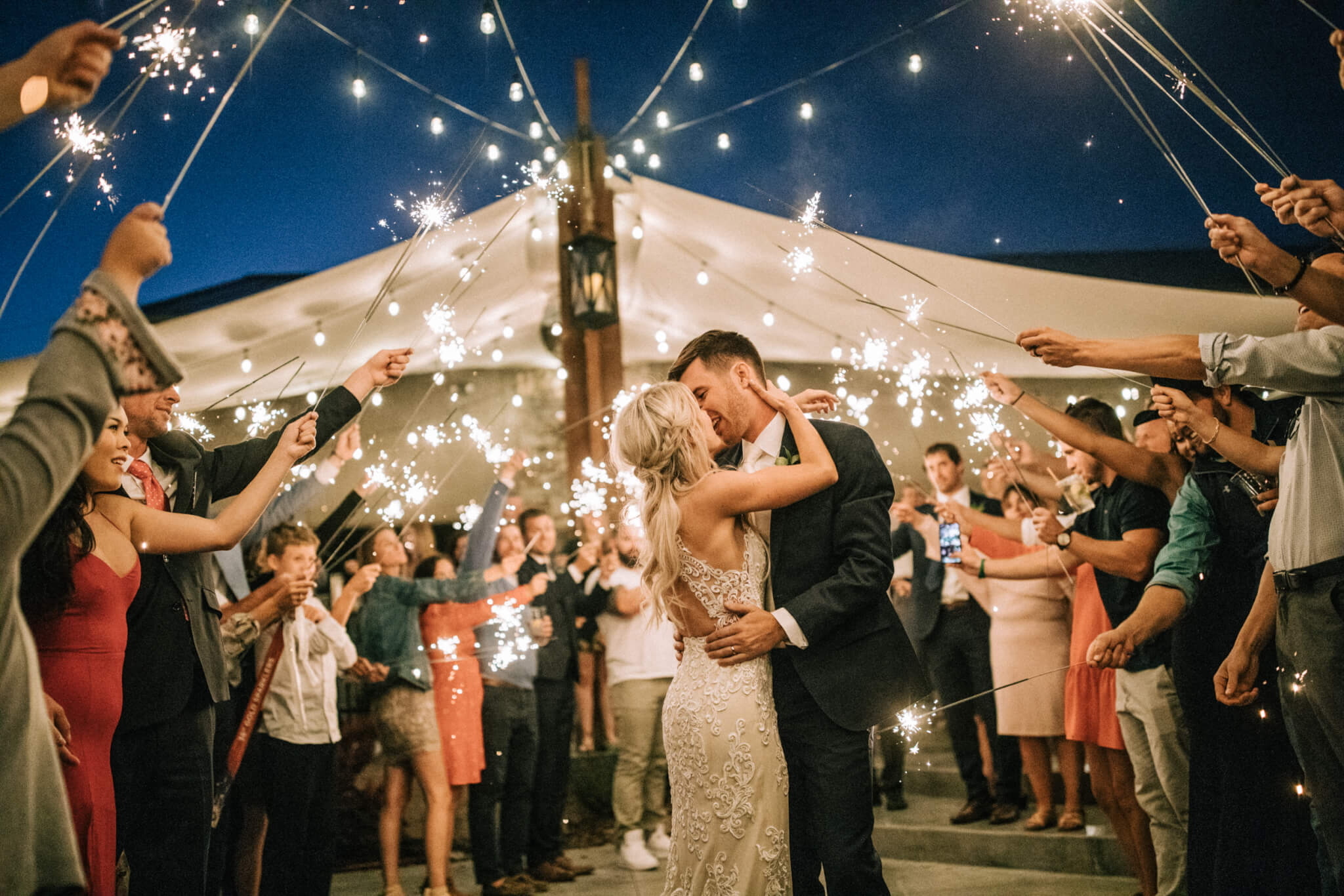 Des Moines Wedding Photographers A sparkler send-off at a White Raven wedding outside Missoula, Montana